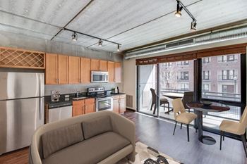 Industrial modern loft design of exposed concrete and plank flooring